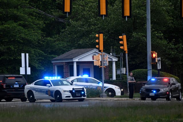 <p>Police cars are seen outside the CIA headquarters's gate after an attempted intrusion earlier in the day in Langley, Virginia, on May 3, 2021</p>