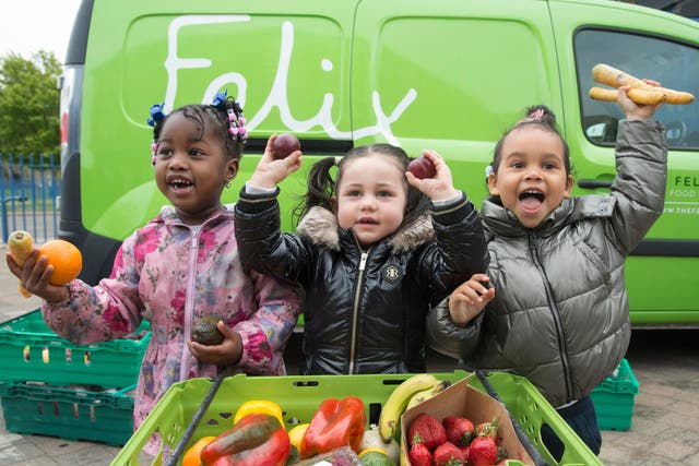 <p>Dream, Aaliyah and Eva Rosie with fruit and veg provided by The Felix Project</p>