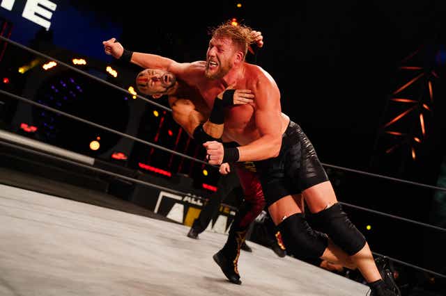 Jake Hager wrestles in a match against Brandon Cutler