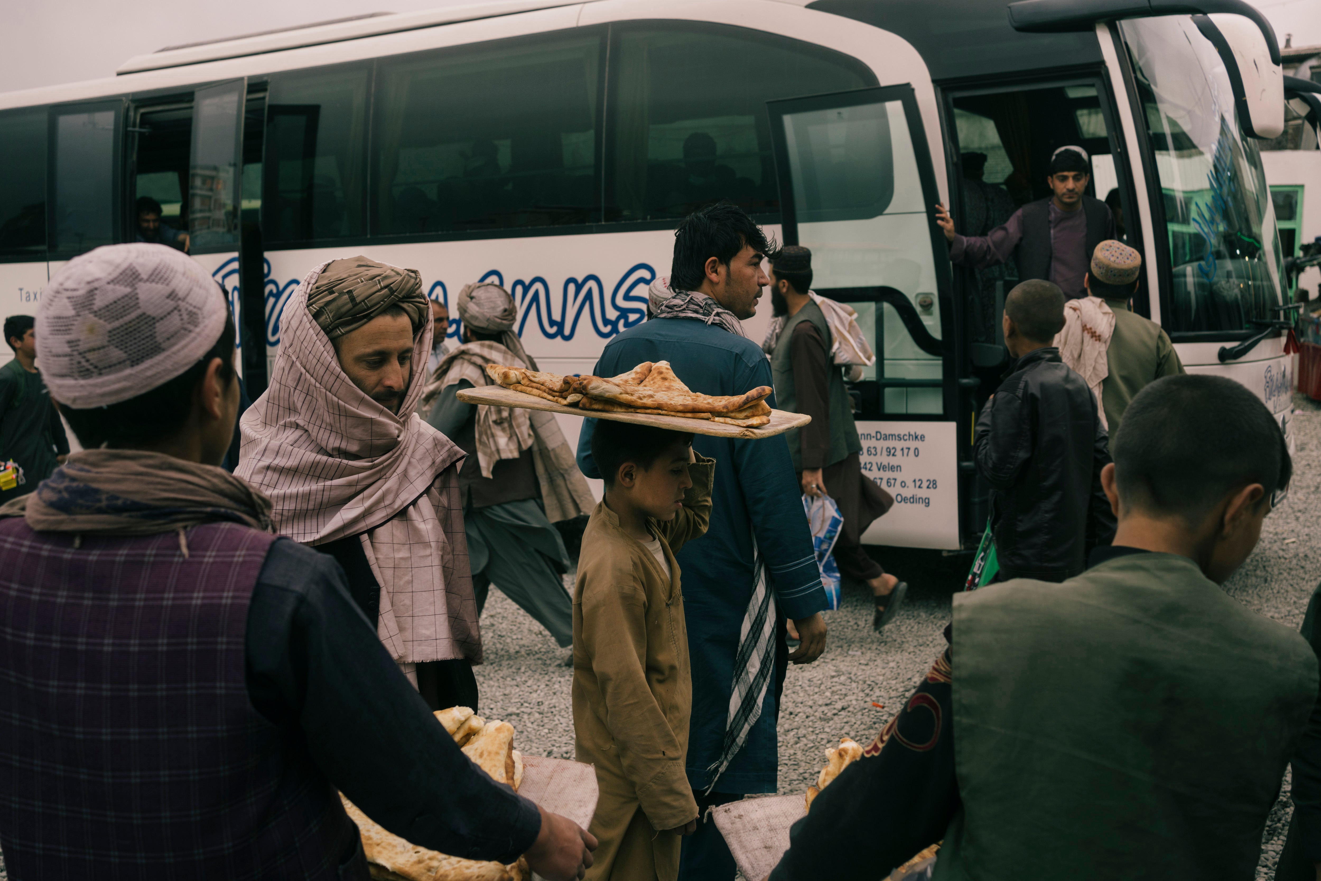 Buses leave the Campani area of Kabul for the south