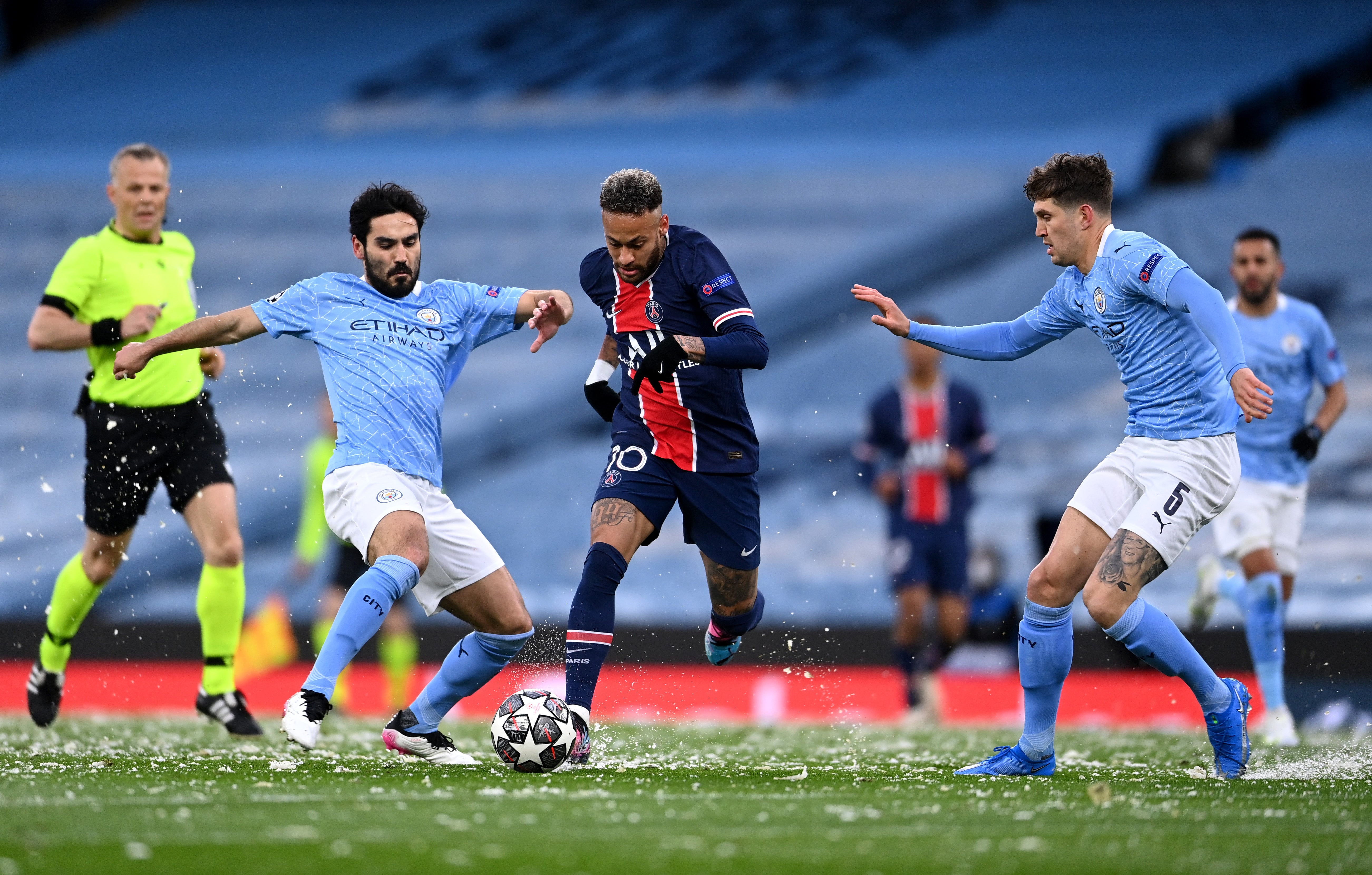 Ilkay Gundogan (left) and John Stones challenge PSG winger Neymar