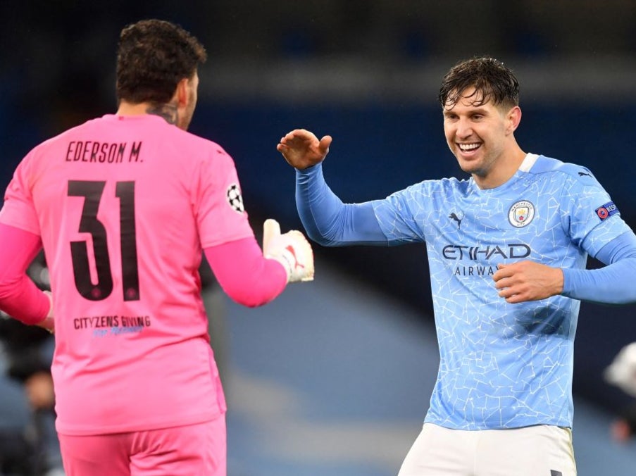 John Stones celebrates with goalkeeper Ederson