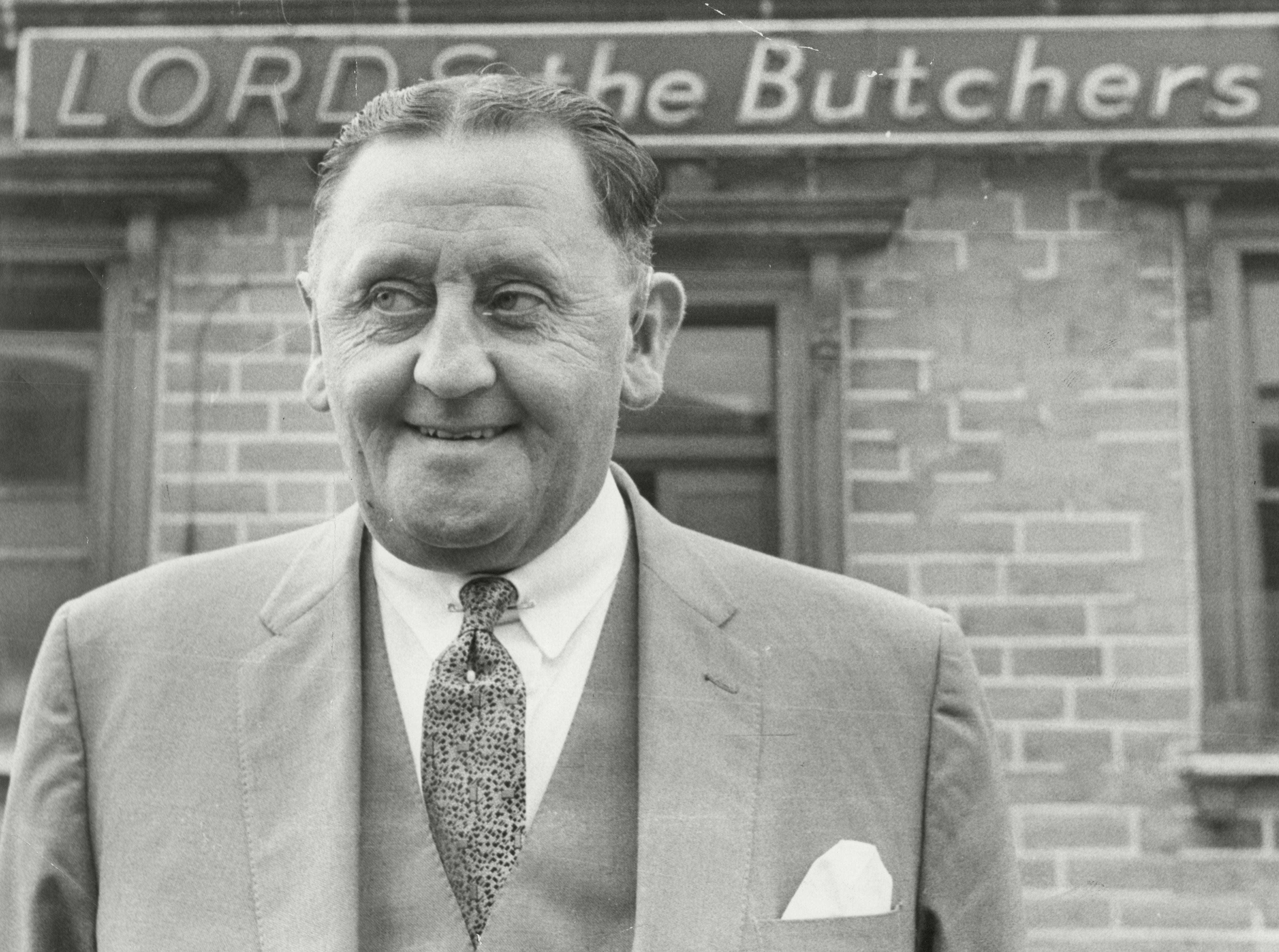 Bob Lord, chair of Burnley, outside his butchery business in September 1962