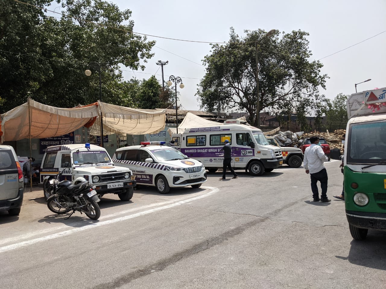 The scene outside the Seemapuri cremation ground, where an ambulance bring a dead body every few minutes