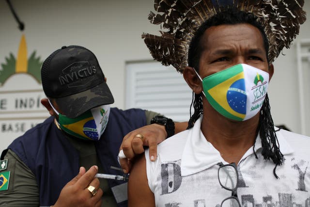 Healthcare workers have reportedly been confronted by crowds armed with bows and arrows while attempting to deliver the Covid-19 vaccine to an indigenous community in Brazil