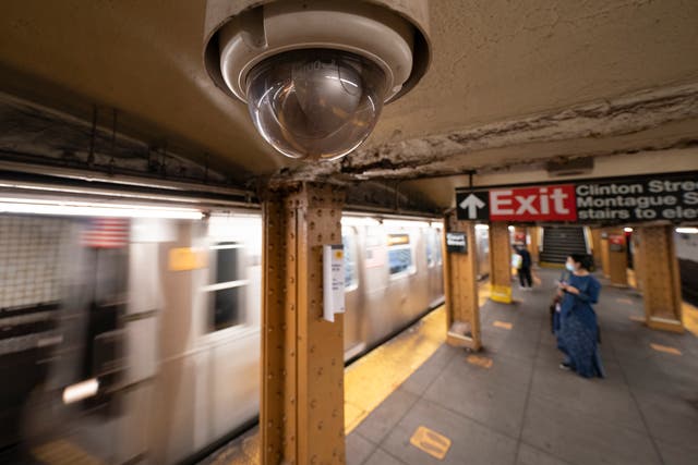 <p>The robbery suspect attempted to jump onto a moving train from the platform when he slipped between the cars and hit the third rail, police said </p>