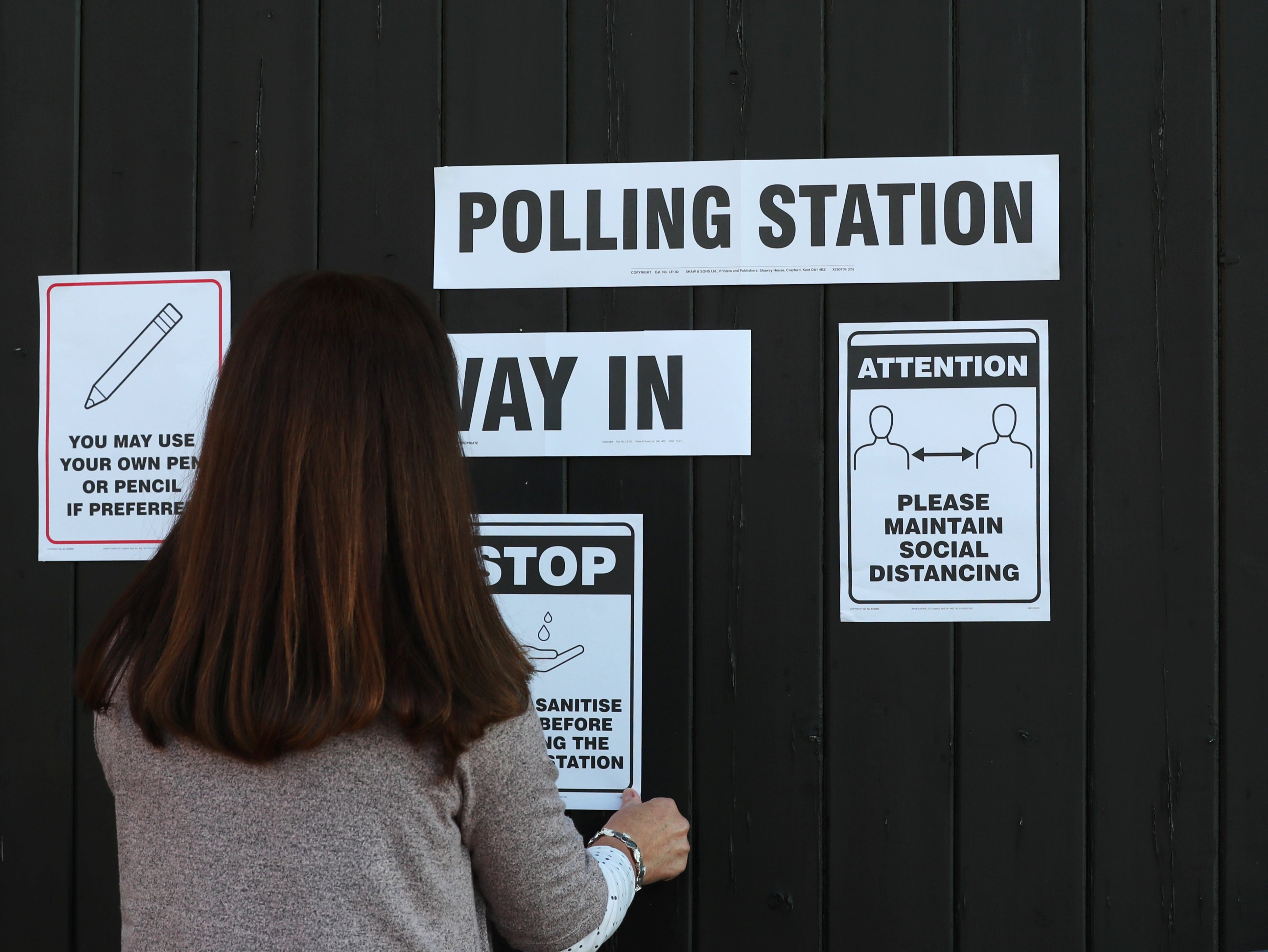 Put up signs. Polling Station.