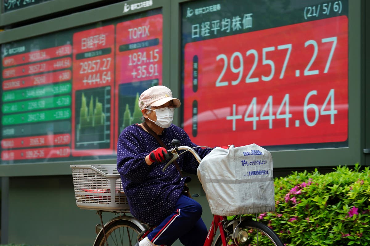 Asian stocks mostly higher on hopes for pandemic recovery
