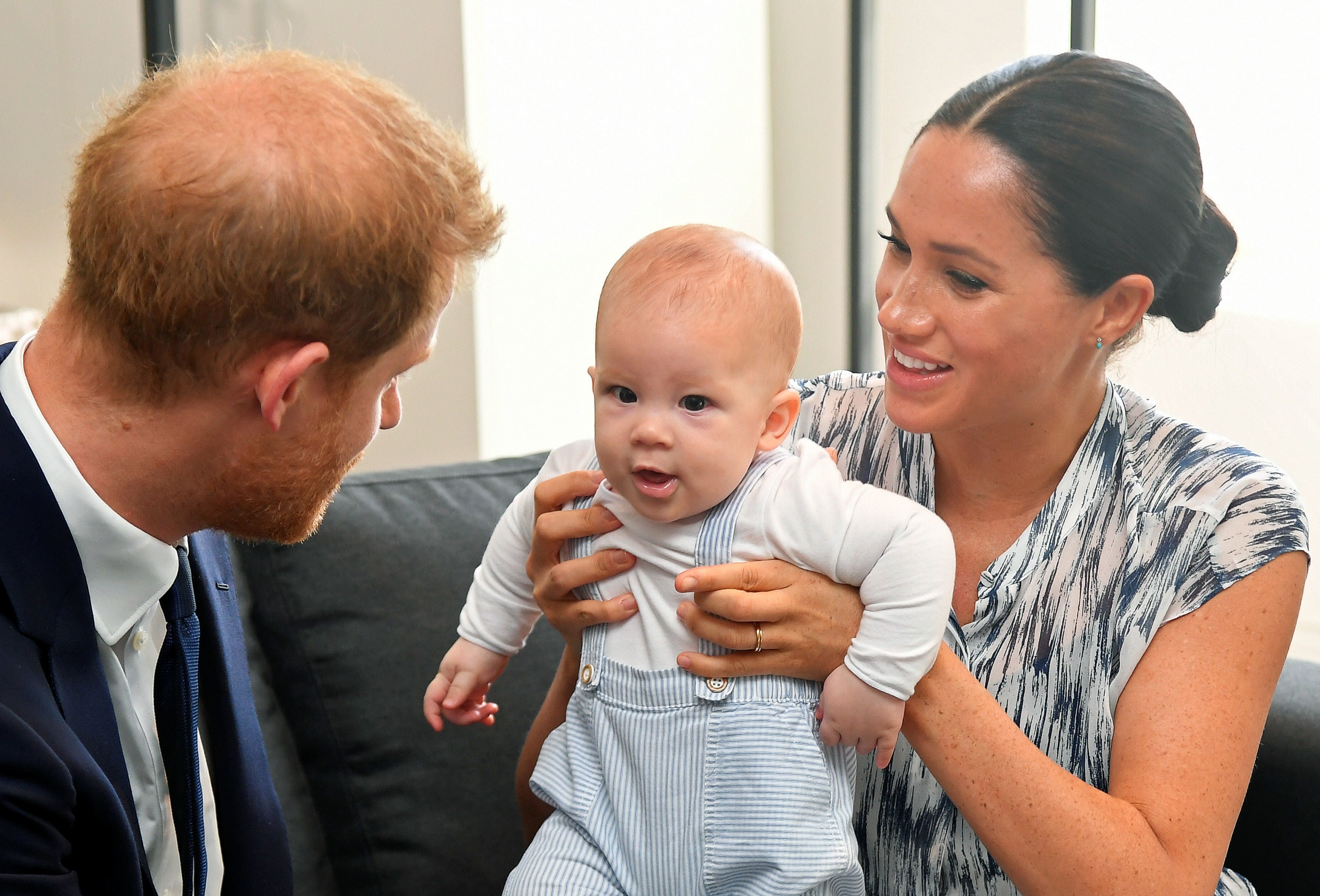 The Duke and Duchess of Sussex holding their son Archie