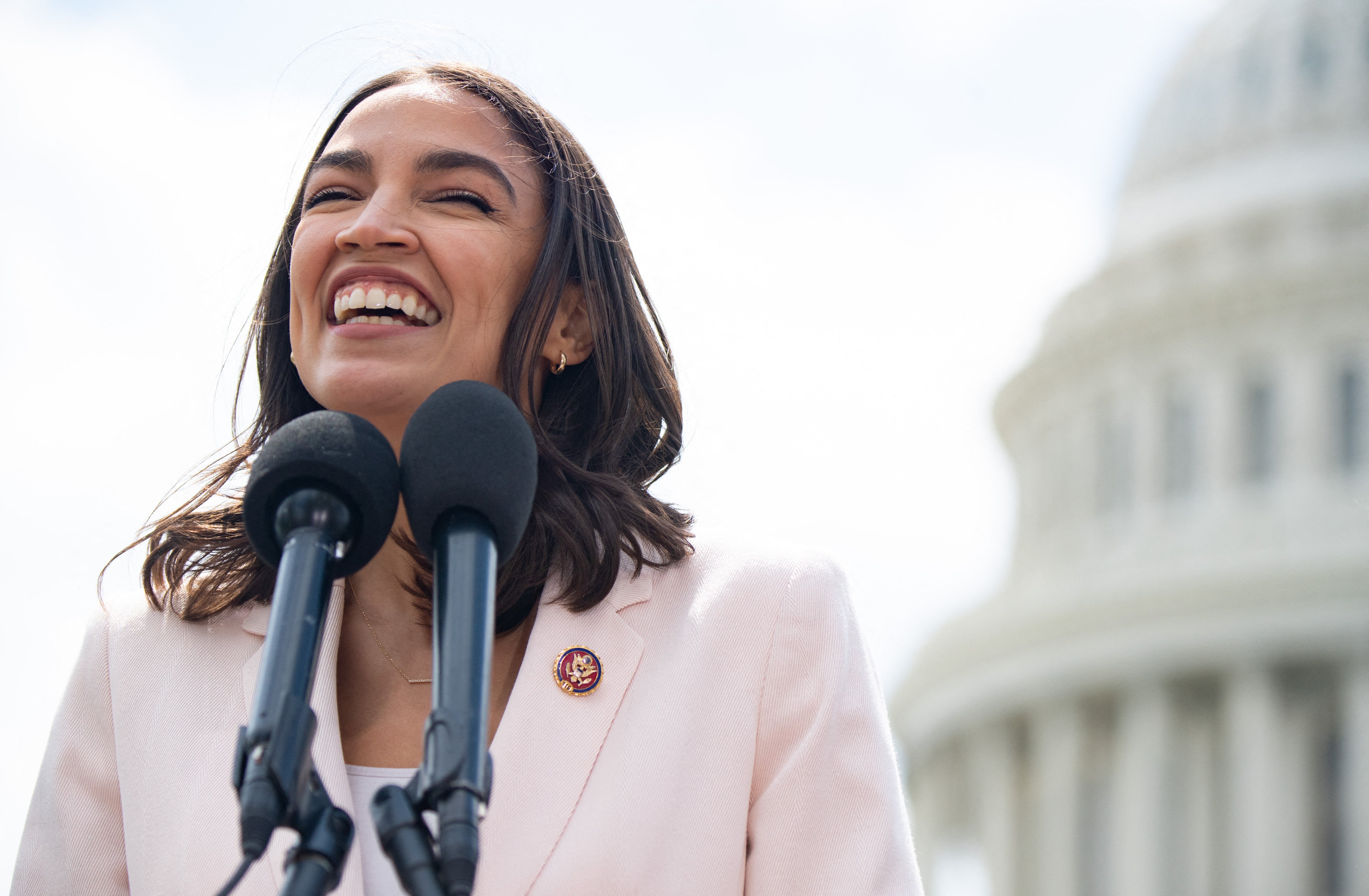 File Image: US Representative Alexandria Ocasio-Cortez, Democrat of New York, attends a press conference about a postal banking pilot program outside the US Capitol in Washington, DC, 15 April 2021