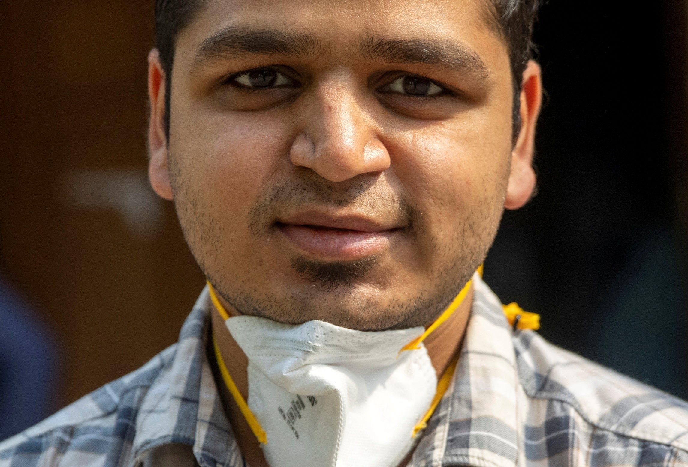 Rohan Aggarwal, 26, a resident doctor who treats patients suffering from coronavirus disease (COVID-19), poses for a photograph as he arrives for a 27-hour shift at Holy Family Hospital in New Delhi, India, May 1, 2021. Aggarwal says he fears what will happen if he gets infected, too, knowing that his own hospital will be unlikely to find him a bed. He is unvaccinated: He was sick in January when shots for medical professionals were being rolled out, and then by February, he began to relax. “We were all under the misconception the virus had gone,” he said. REUTERS/Danish Siddiqui