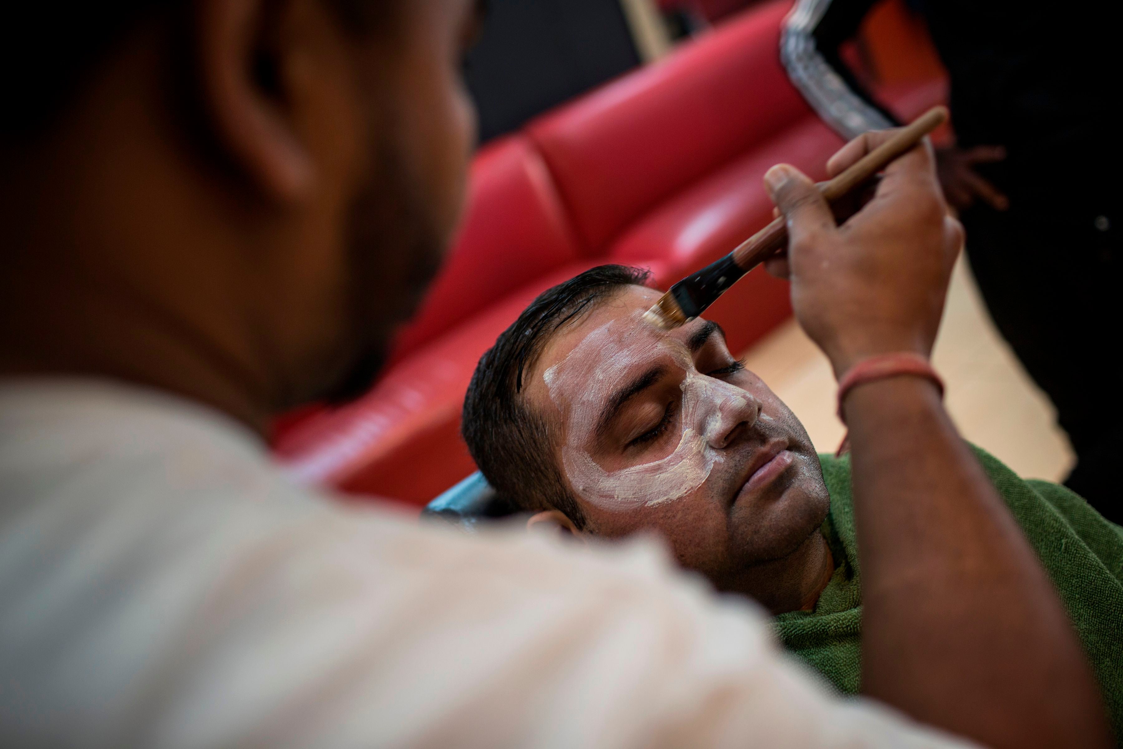 A facial treatment employing skin-lightening products at a hair salon in Johannesburg, South Africa