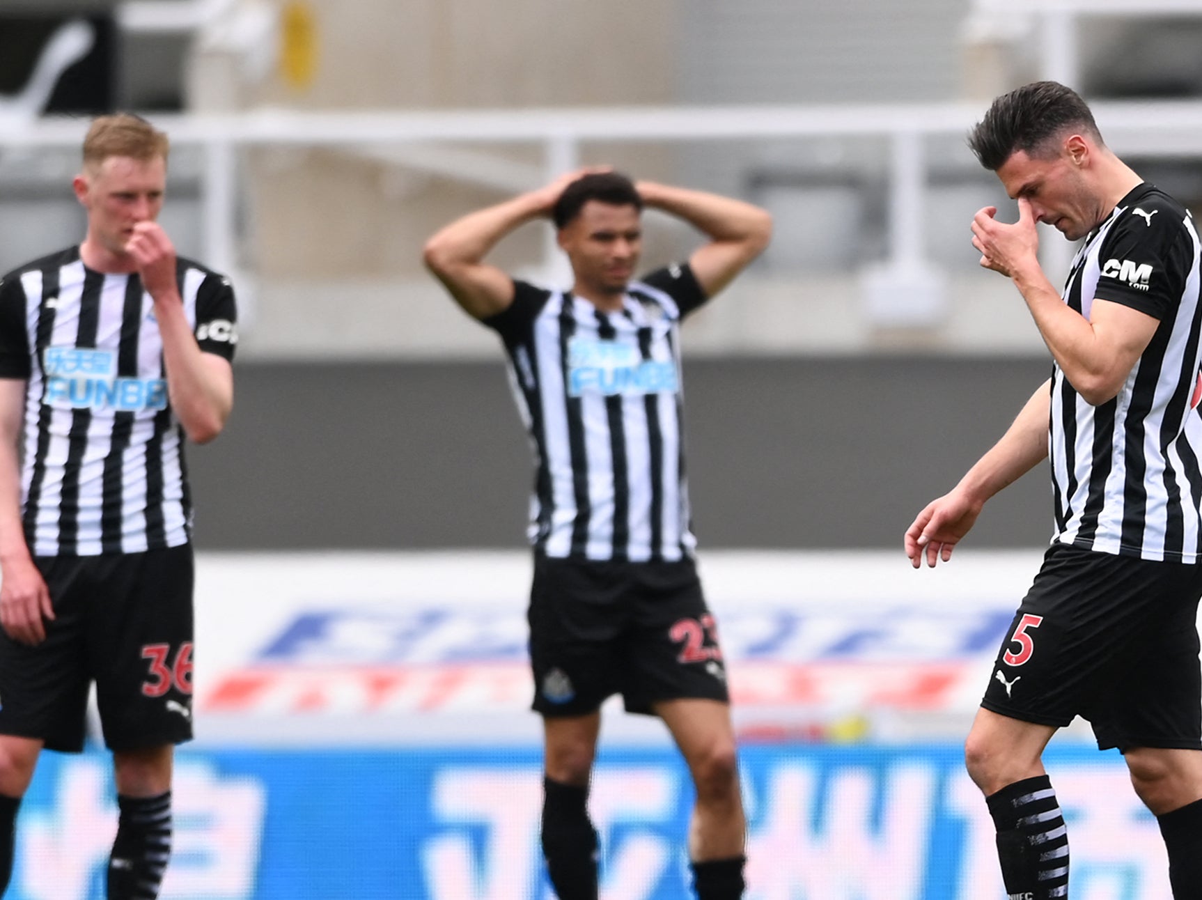 Newcastle players react to Fabian Schar’s (right) red card against Newcastle
