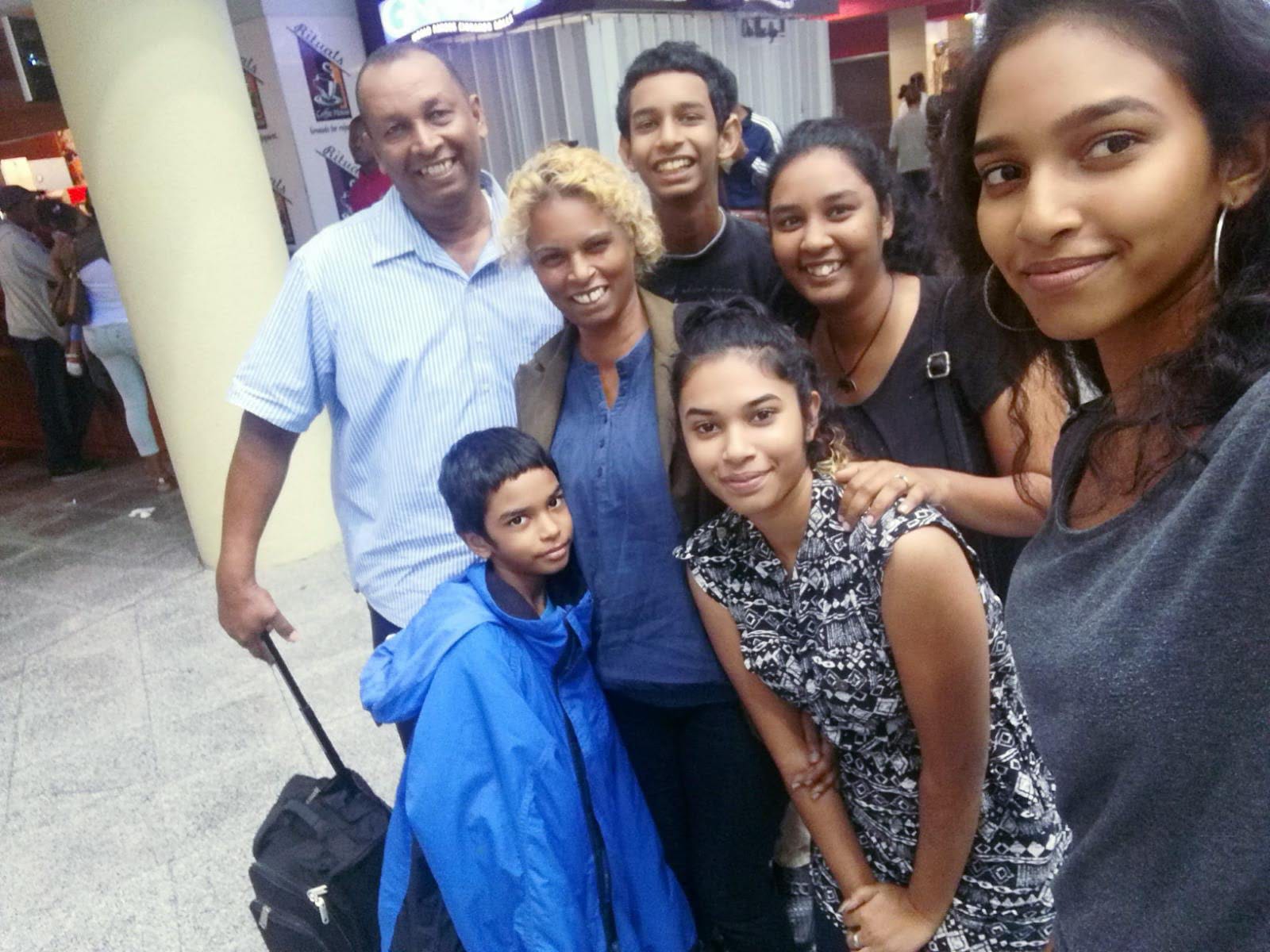 <p>Lynda Mahabir (second left) had hoped it would be a matter of months before her family would be able to join her when she left for the UK in October 2018 – but they are still apart</p>