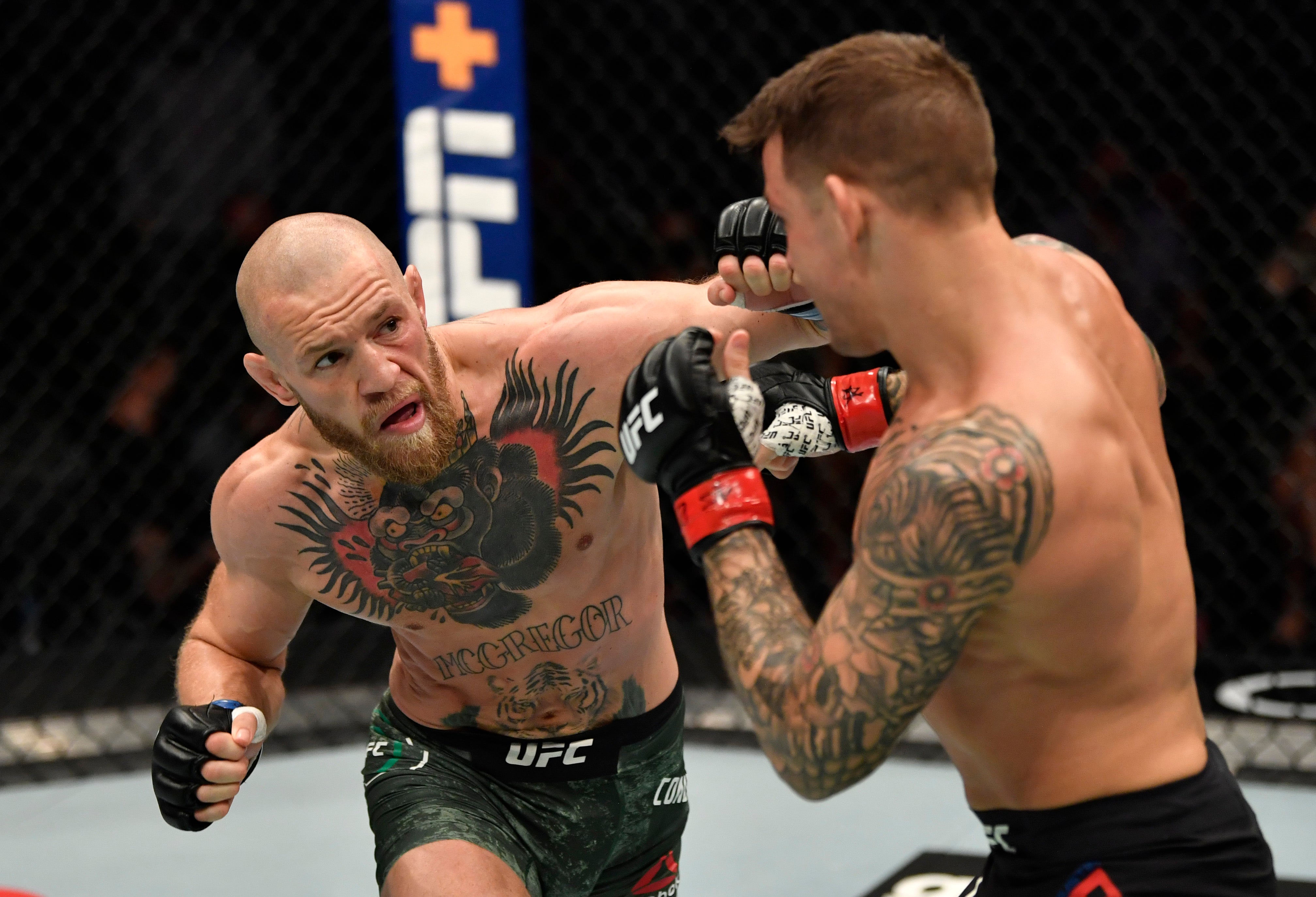 Conor McGregor and Dustin Poirier during their UFC 257 clash
