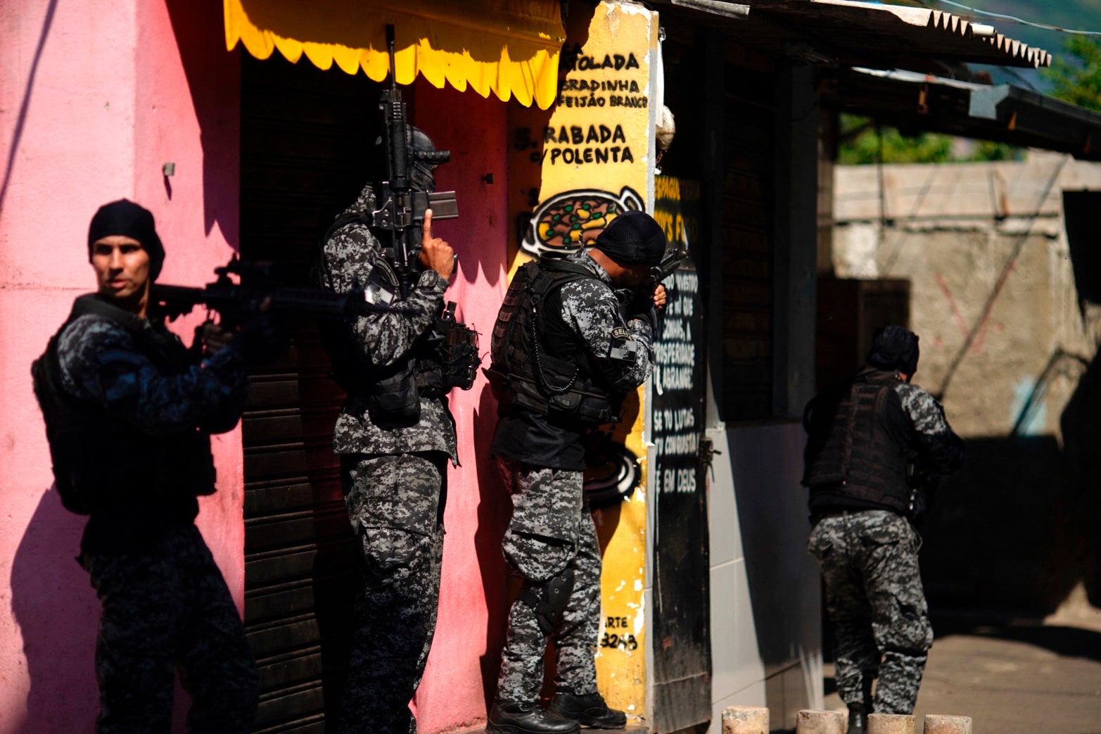 Police officers carry out a raid against drug traffickers in the Jacarezinho area of Rio de Janeiro