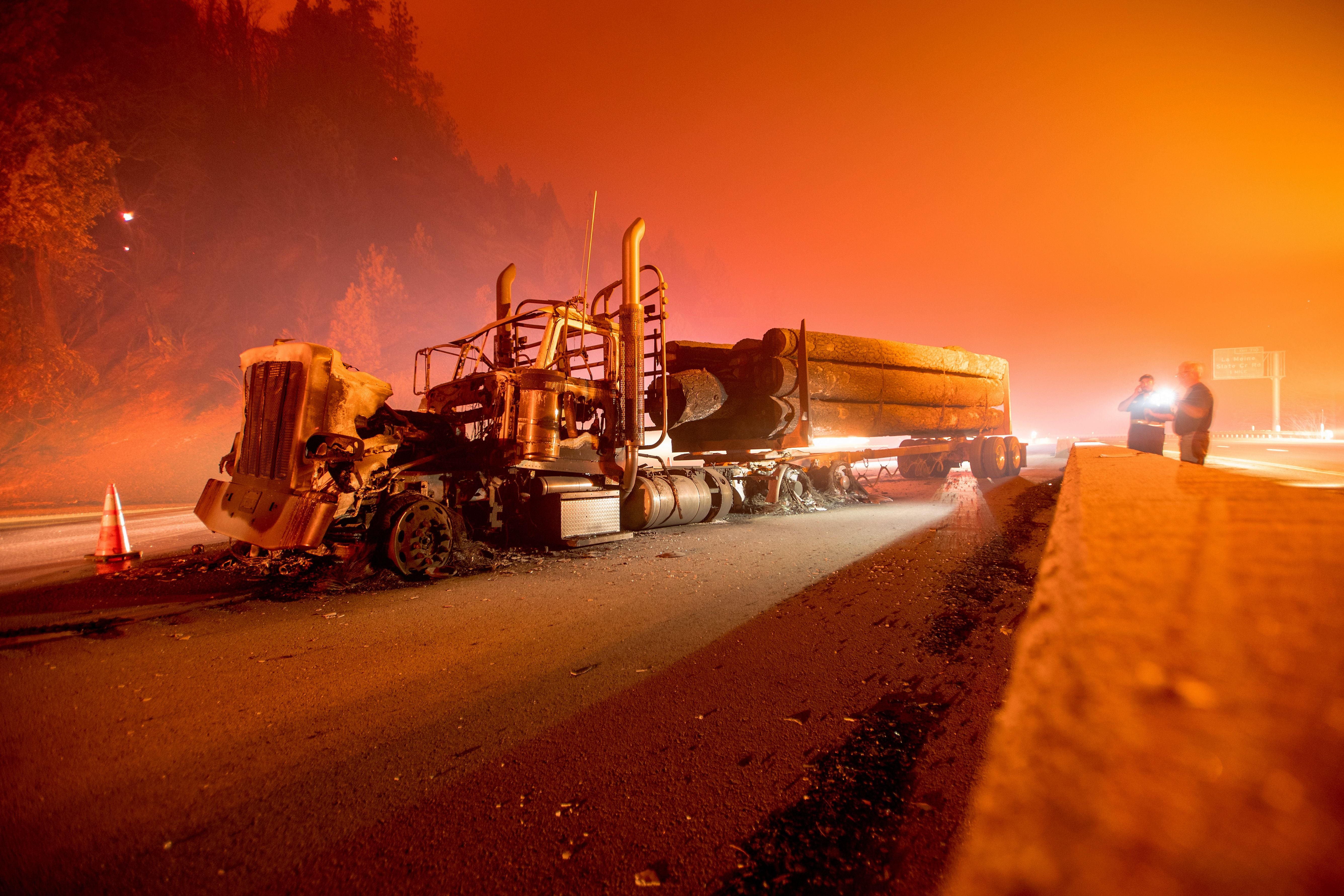 An abandoned smoldering truck after the Delta Fire tore through the area north of Redding, California and jumped the interstate on 5 September 2018