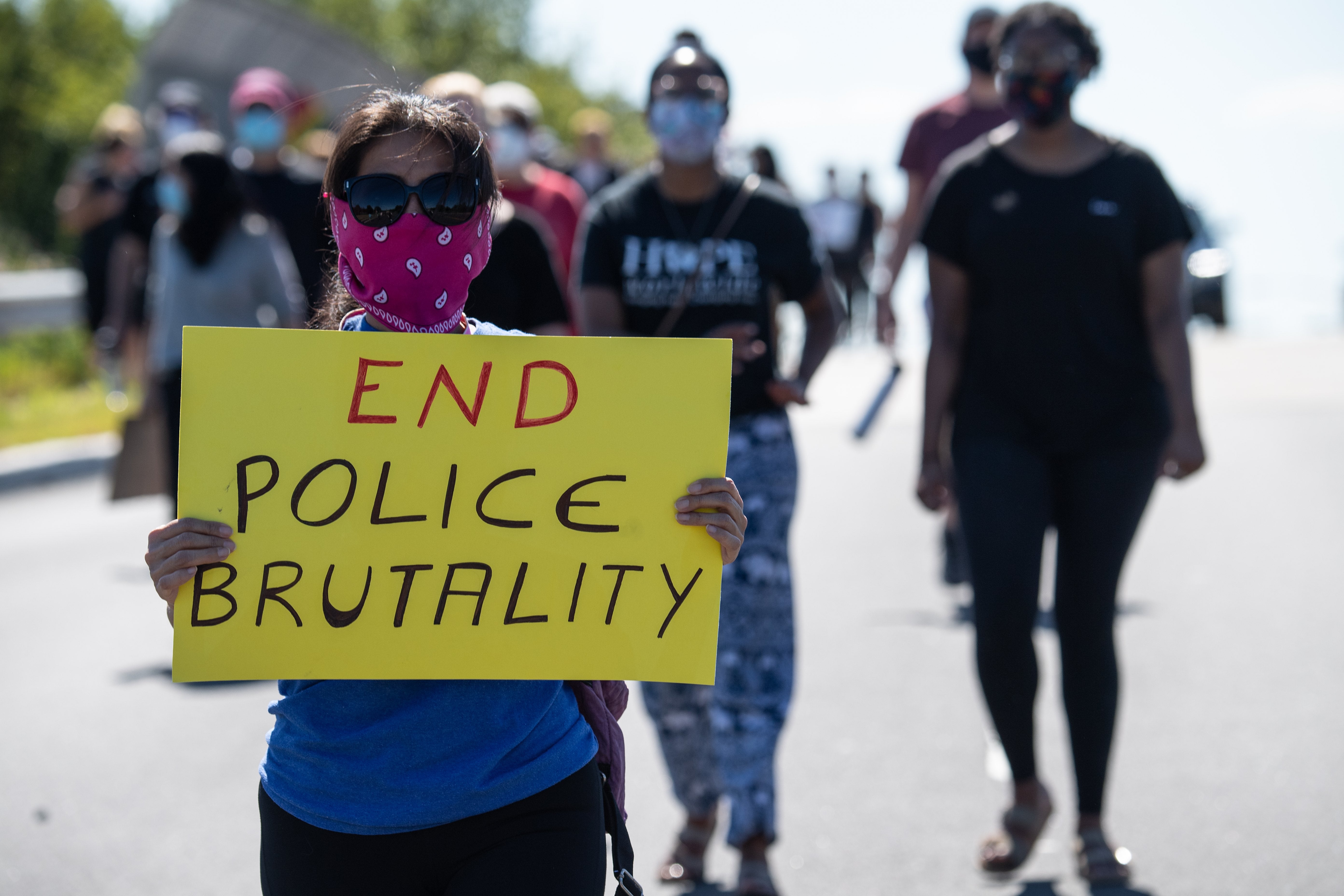 <p>Protesters march in Bridgewater, New Jersey, on 13 June 2020 during a demonstration against police brutality and racism following the murder of George Floyd in Minneapolis on 25 May. </p>