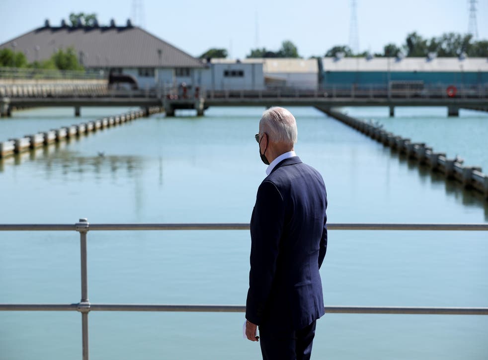 <p>Joe Biden looks out at the New Orleans Sewerage & Water Board’s facility on 6 May.</p>