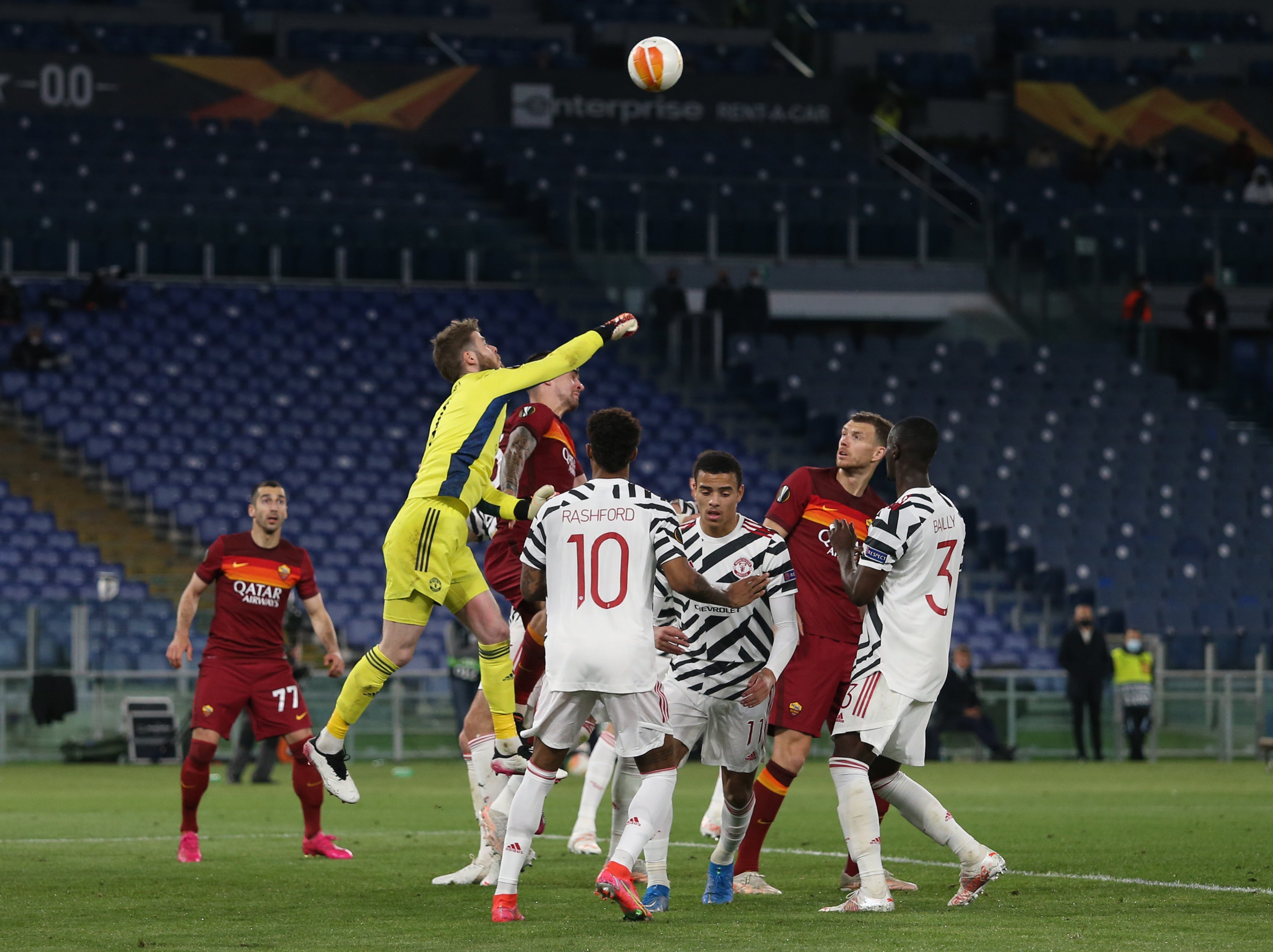 David de Gea punches the ball away during the second leg against Roma