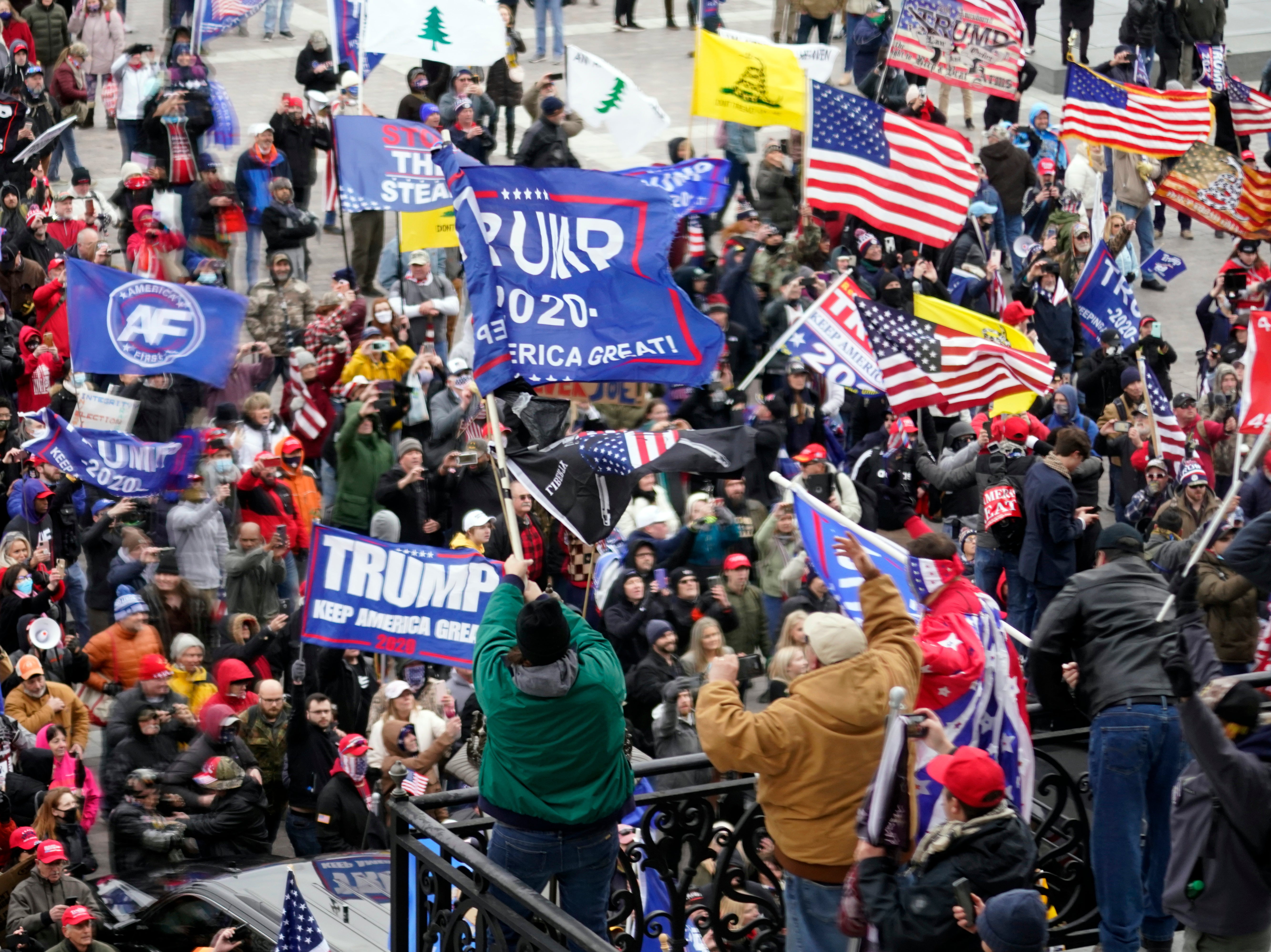 <p>Violent protesters gather outside the US Capitol in Washington on 6 January, 2021</p>