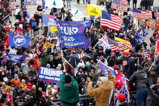 <p>Violent protesters gather outside the US Capitol in Washington on 6 January, 2021</p>