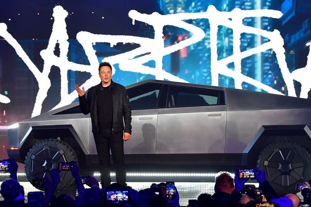 <p>Tesla co-founder and CEO Elon Musk introduces the newly unveiled all-electric battery-powered Tesla Cybertruck at Tesla Design Center in Hawthorne, California on November 21, 2019</p>