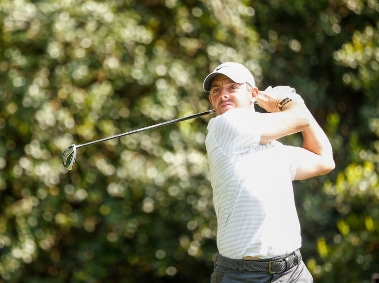 Rory McIlroy of Northern Ireland plays his shot from the 14th tee