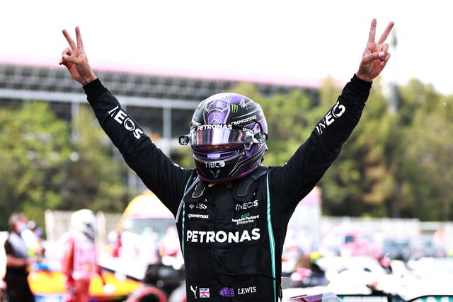Lewis Hamilton celebrates clinching victory in Spain