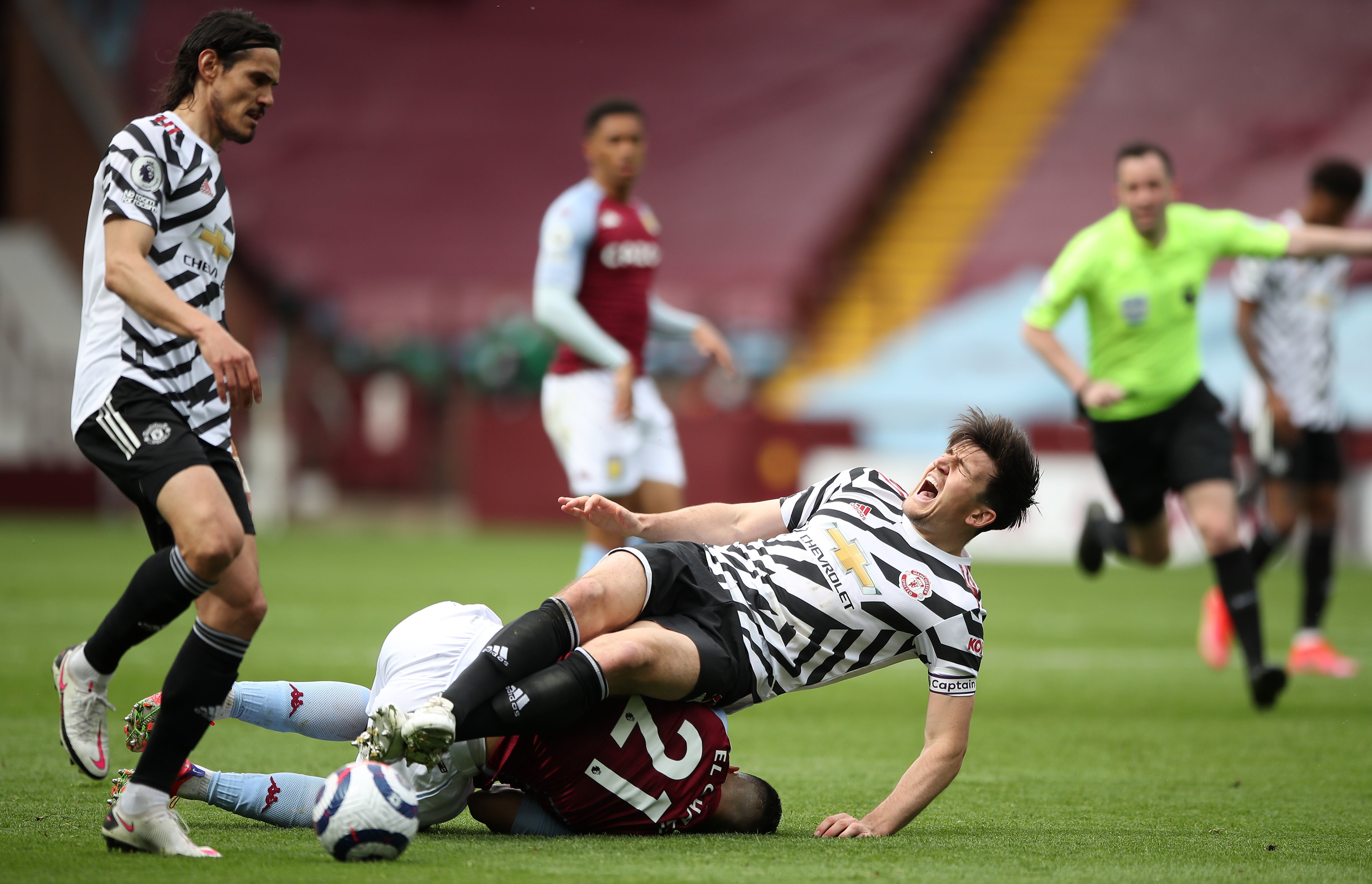 Harry Maguire appeared to injure his left ankle at Villa Park