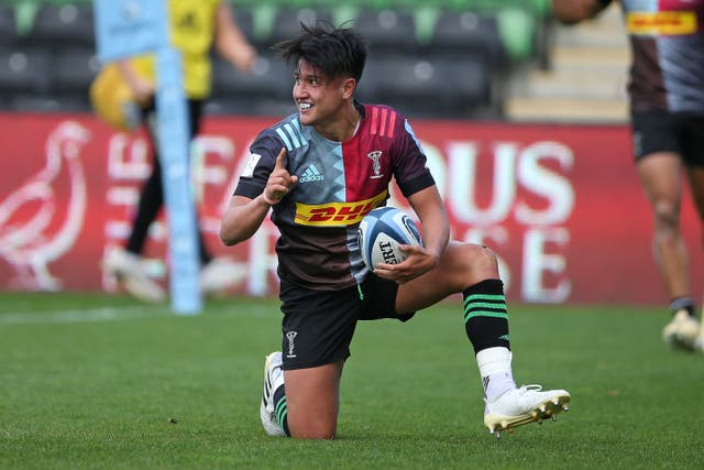 <p>Marcus Smith celebrates scoring the game-winning try</p>