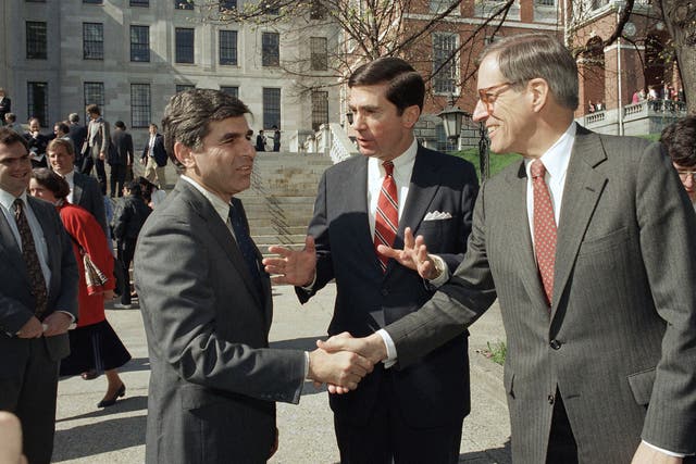 <p>Pete du Pont (right) shakes hands with Governor Michael Dukakis of Massachusetts in April 1987</p>