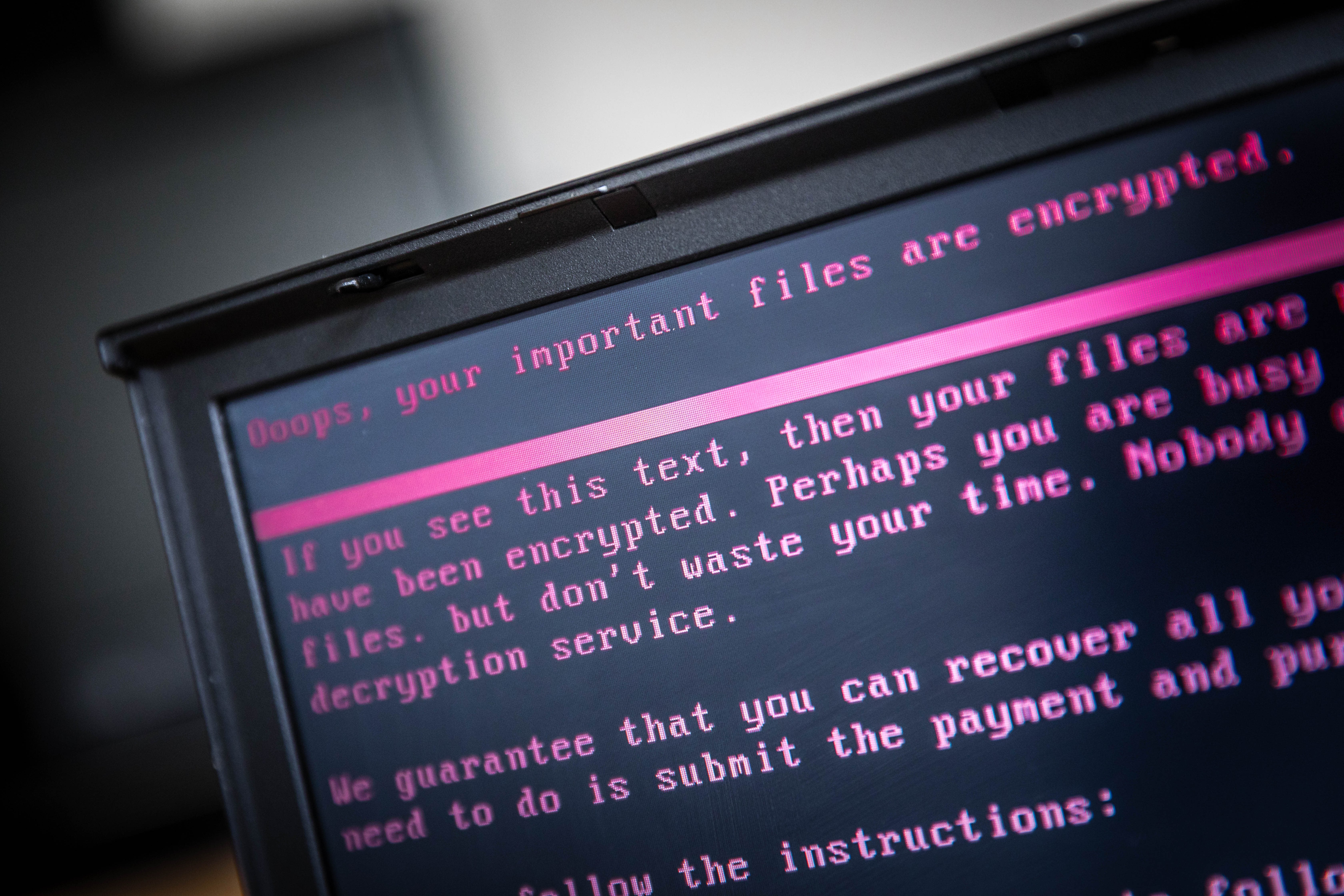 A laptop displays a message after being infected by a ransomware as part of a worldwide cyberattack on June 27, 2017