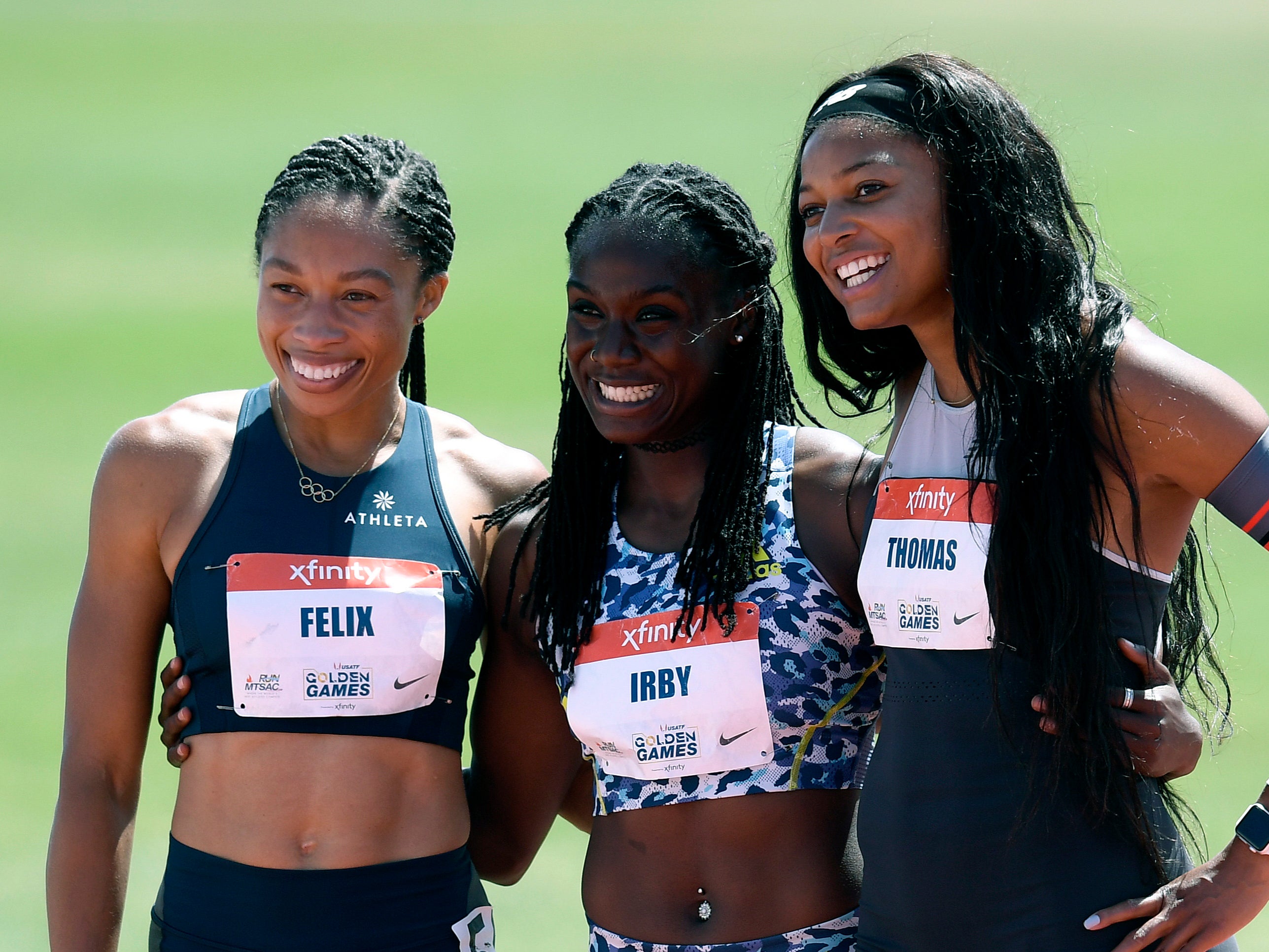 Allyson Felix, Lynna Irby and Gabby Thomas pose after the women’s 200m at the Golden Games