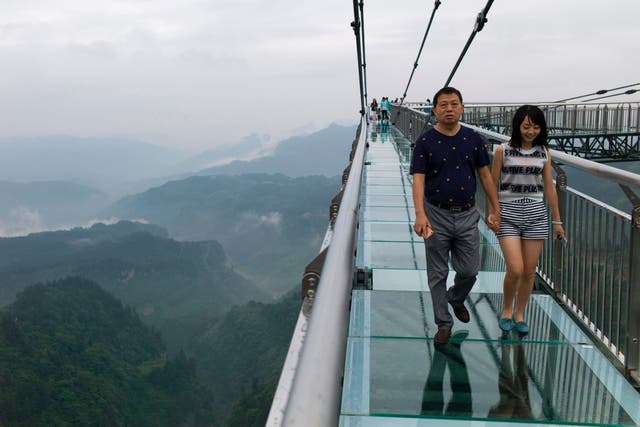 <p>File A glass-bottomed skywalk, certified as the world’s longest, at the Ordovician park in Wansheng.  Hovering more than 100 metres (328 feet) above a gaping chasm</p>