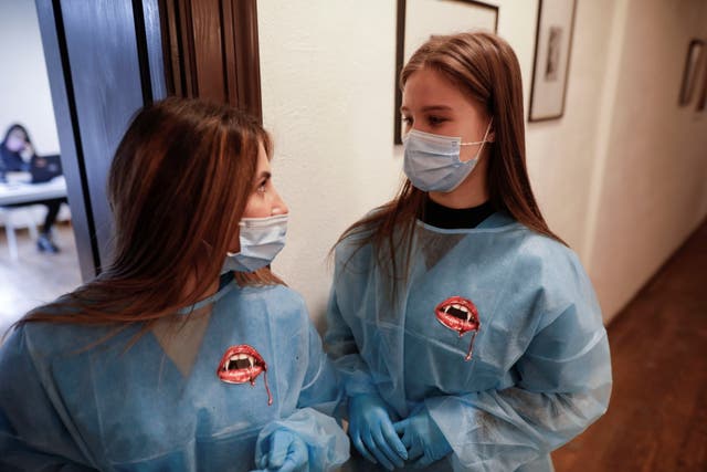 Medical workers are pictured at a vaccine centre at Bran Castle, Romania, on 8 May, 2021. 