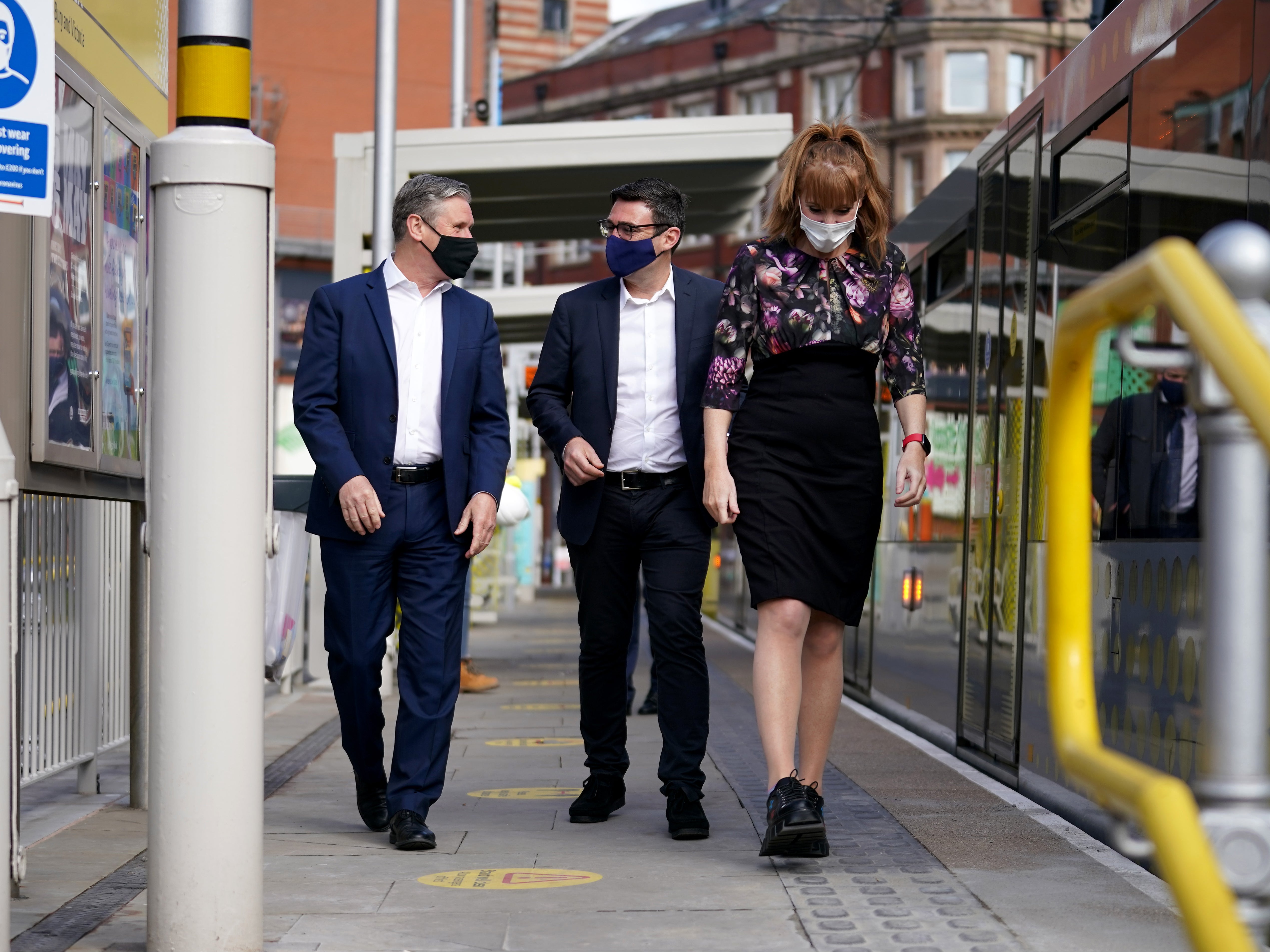 Keir Starmer, left, with Andy Burnham, centre, and Angela Rayner on the campaign trail in April