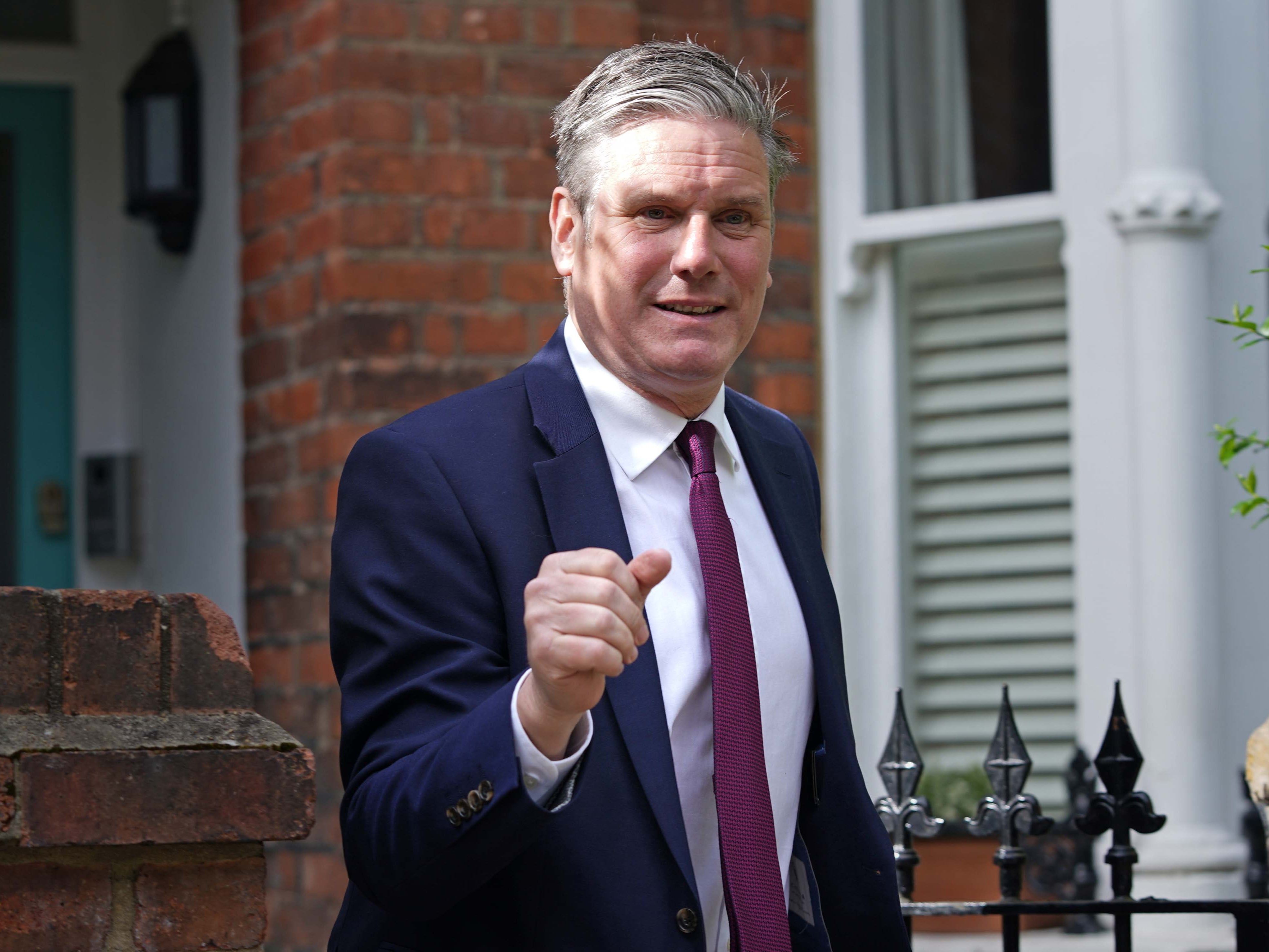 <p>Making a fist of it: Labour leader Sir Keir Starmer outside his north London home on Monday </p>
