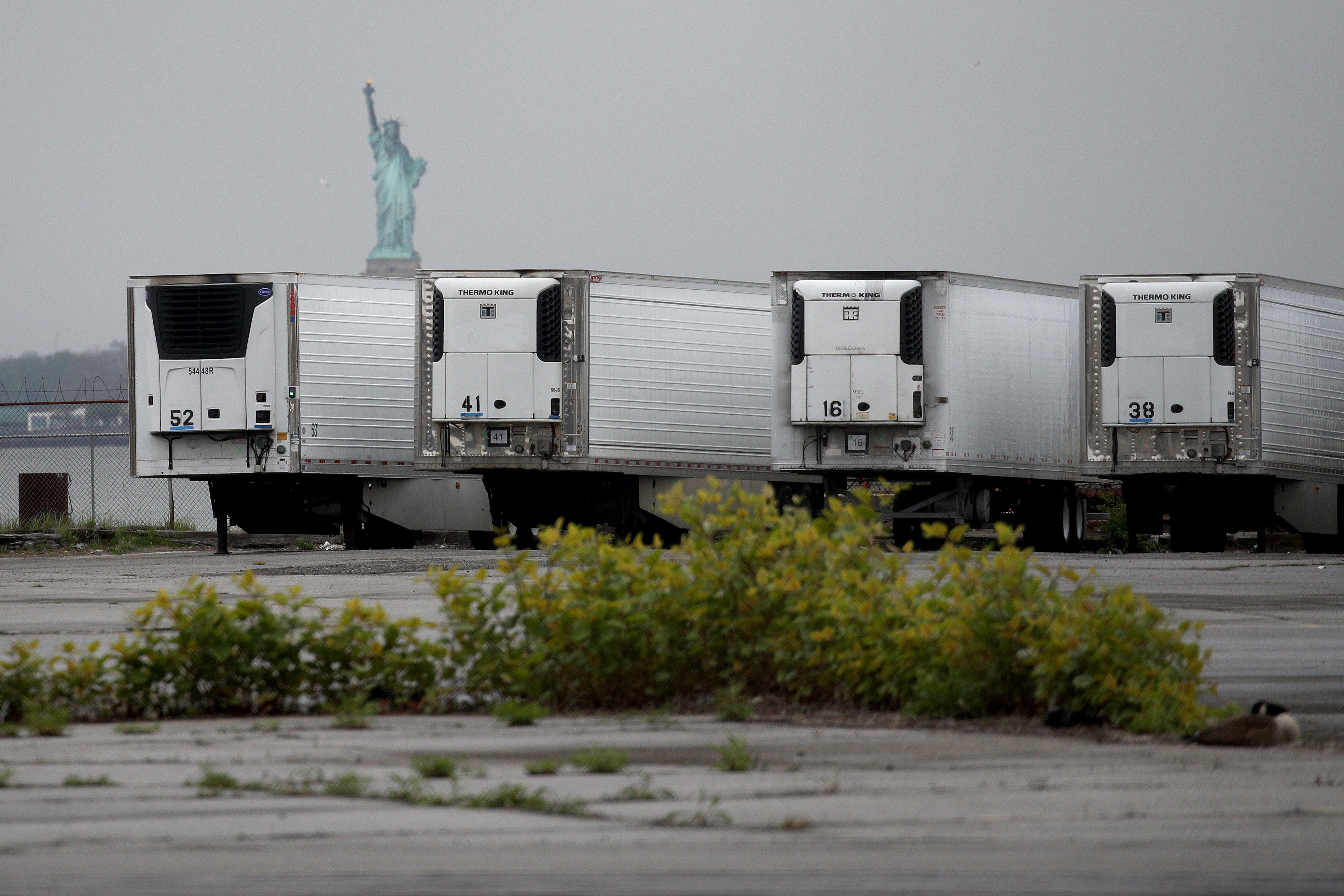 *** BESTPIX *** NEW YORK, NEW YORK - MAY 06: Refrigerated trucks functioning as temporary morgues are seen at the South Brooklyn Marine Terminal on May 06, 2020 in the Brooklyn borough of New York City. New York City's Medical Examiner are now operating a long-term disaster morgue at Brooklyn's 39th Street Pier, where human remains will be kept inside freezer trucks, in an effort to provide relief to funeral directors overwhelmed from the COVID-19 crisis. (Photo by Justin Heiman/Getty Images)