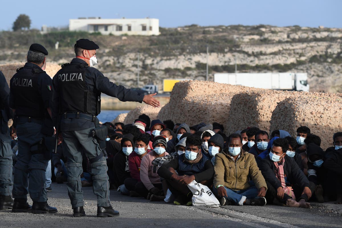 Migrant arrivals by sea on Italian island swell past 2,100
