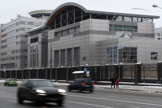 <p>Cars drive past the headquarters of the Russian General Staff's Main Intelligence Department (GRU) in Moscow on December 30, 2016</p>
