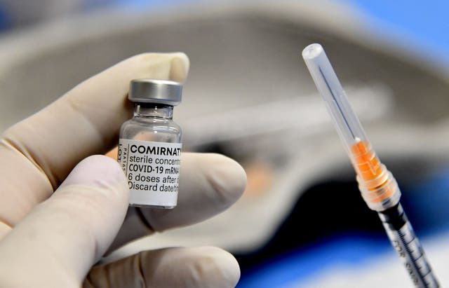 <p>Representative: A medical worker holds a syringe and a vial of the Comirnaty vaccine by Pfizer-BioNTech against Covid-19 on 22 April 2021 at the San Giovanni Addolorata hospital in Rome</p>