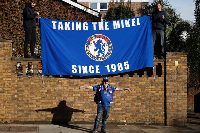 Chelsea fans with a flag outside the stadium