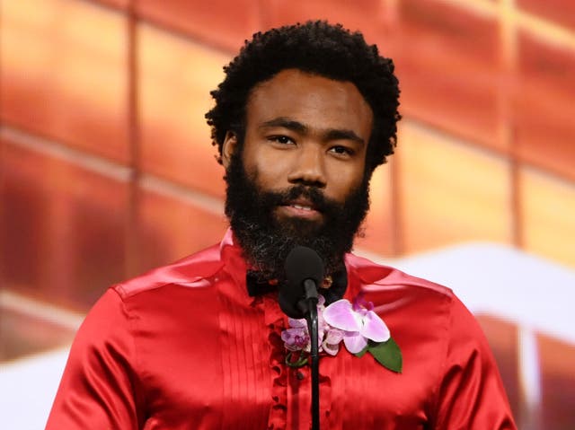 Donald Glover speaking onstage at the British Academy Britannia Awards in 2019