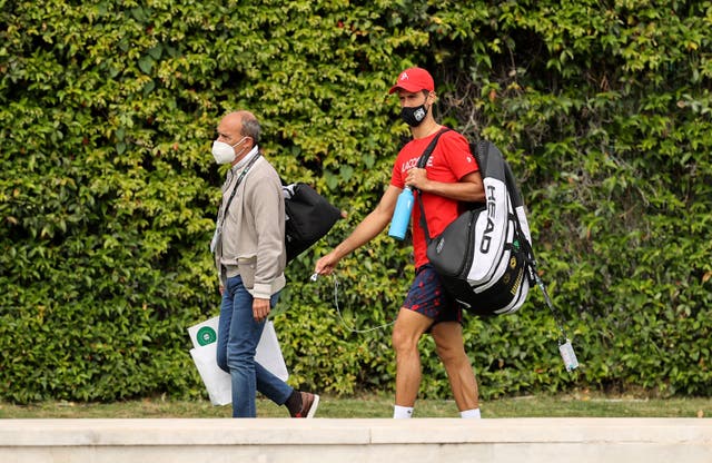 Novak Djokovic of Serbia walks to practice with agent, Edoardo Artaldi at Foro Italico
