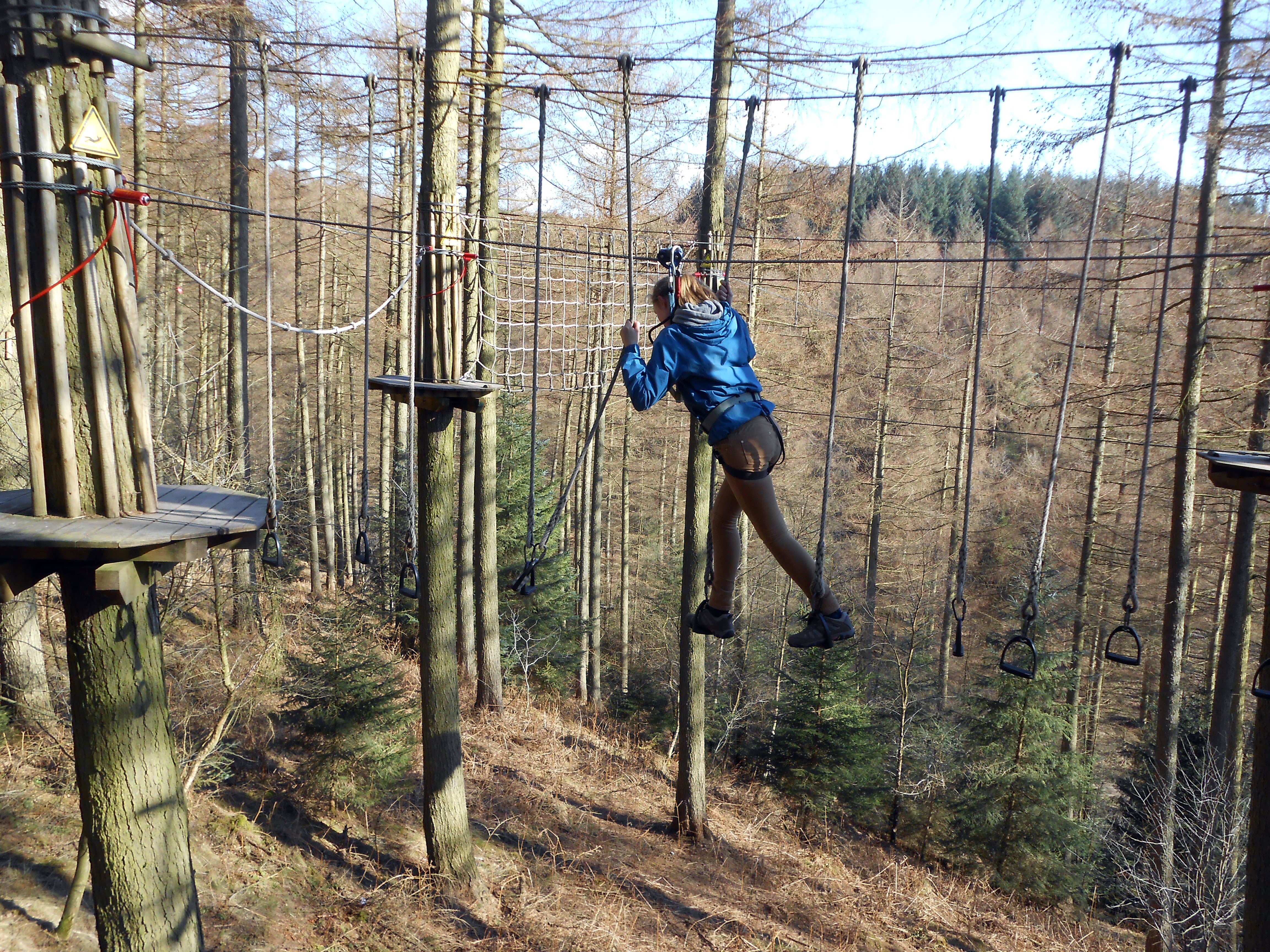 Teenage girl doing Go Ape in Dalby forest.. Image shot 04/2013. Exact date unknown.