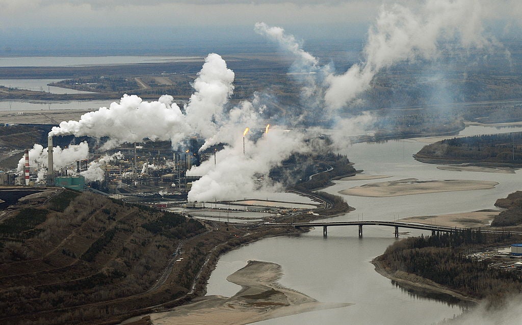 Aerial view of the Suncor oil sands extraction facility on the banks of the Athabasca River and near the town of Fort McMurray in Alberta, Canada