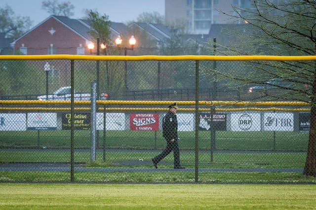 <p>A Capitol Police officer walks the perimeter of the field as members of the Republican Congressional Baseball Team hold practice at Simpson Field on 25 April 2018 in Alexandria, Virginia. The practice was the first time the members of Congress have returned to the scene of last year's shooting where House Majority Whip Rep. Steve Scalise (R-La.), and four others, including two Capitol Police officers, were wounded when a gunman opened fire on 14 June 2017.  </p>