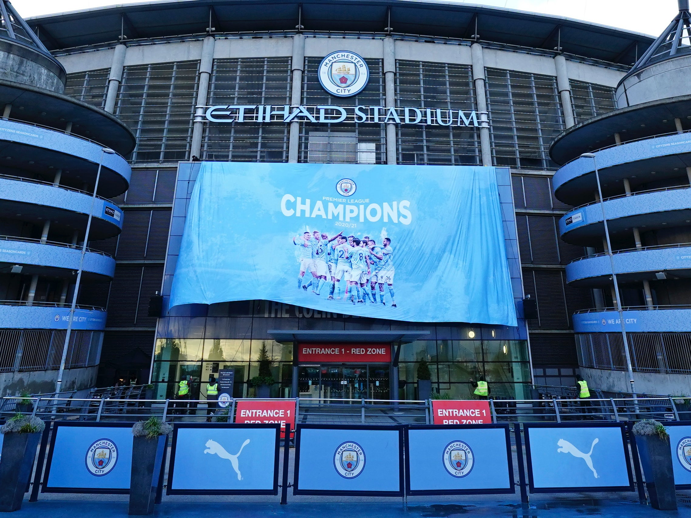 A Premier League champions banner is unfurled at Etihad Stadium
