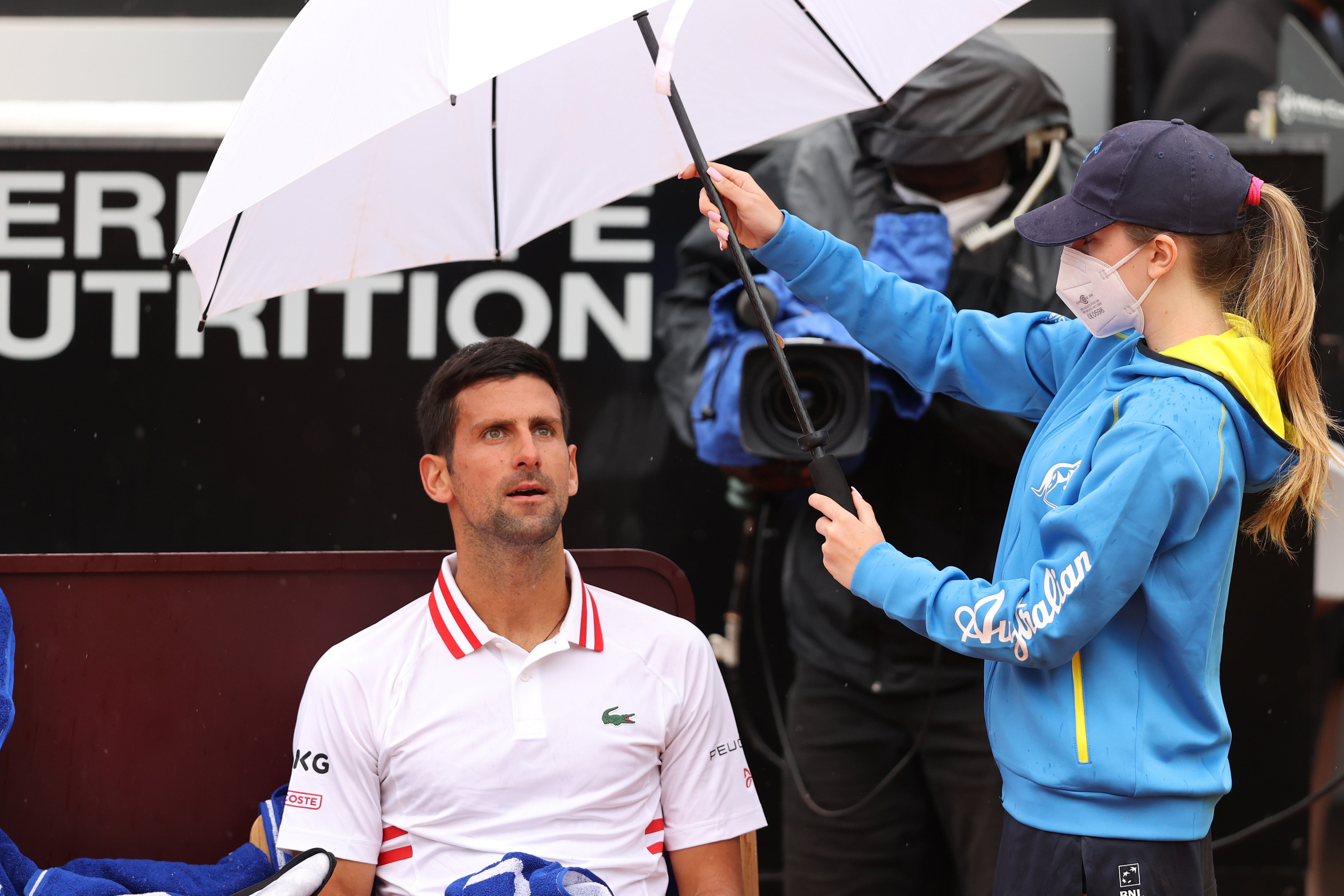 Novak Djokovic eventually progressed to the last-16 after a rain delay